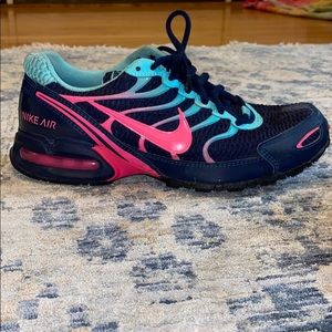 Blue and pink women Nike torch 4 tennis shoes.